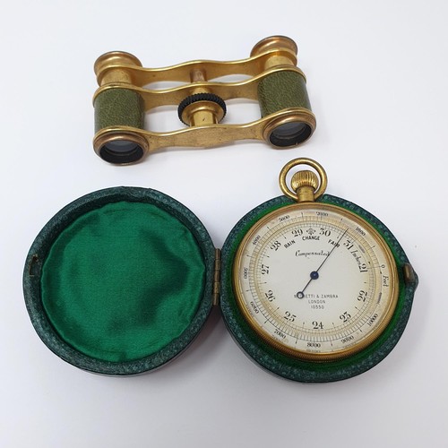 1139 - A pocket barometer, by Negretti & Zambra, in a leather case, initialed and dated 1925, and a pair of... 