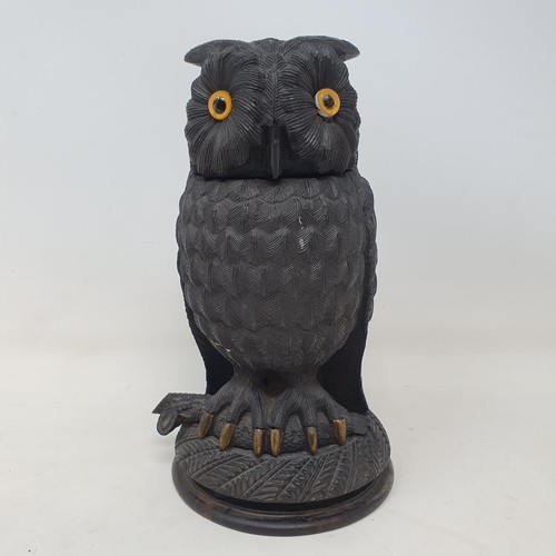 1141 - A 19th century carved inkwell, in the form of an owl, 17 cm high