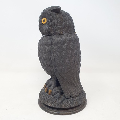 1141 - A 19th century carved inkwell, in the form of an owl, 17 cm high