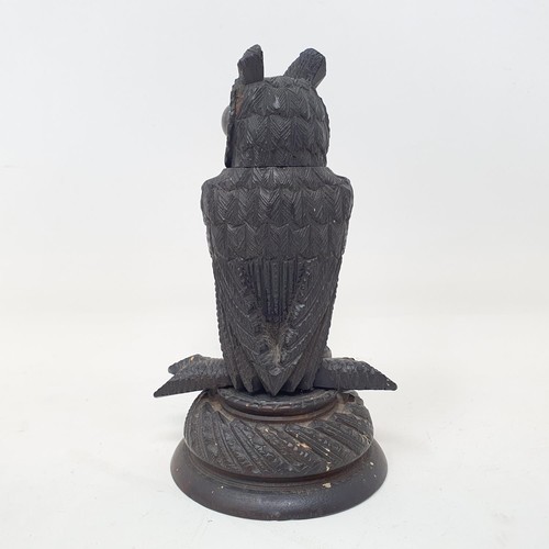 1143 - A 19th century carved inkwell, in the form of an owl, 10.5 cm high