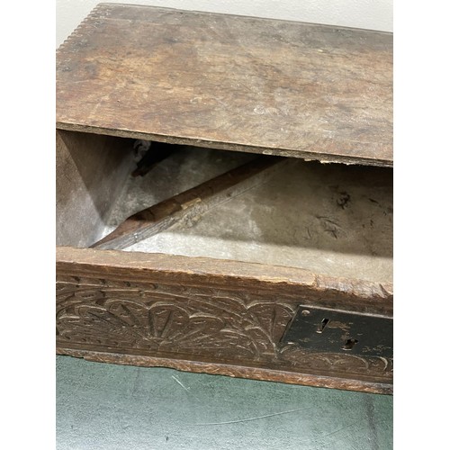 1307 - An oak bible box, in need of extensive restoration, an oak chair, and two rugs (4)