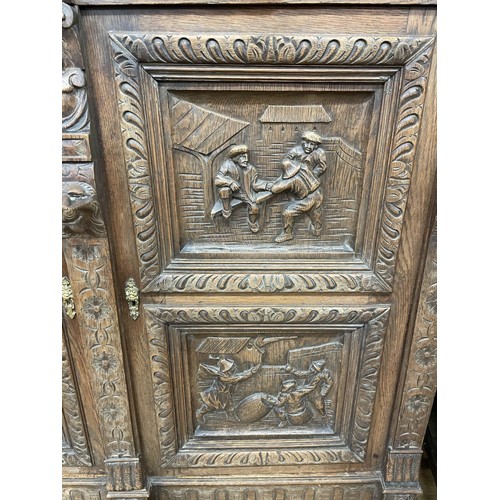 1281 - An early 20th century French carved oak buffet, 131 cm wide