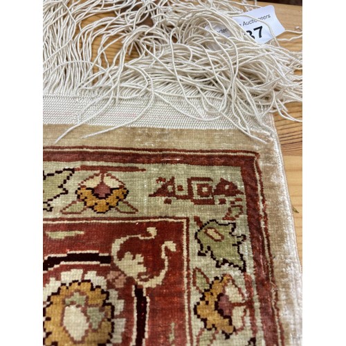 1337 - A Persian silk rug, 104 x 65 cm