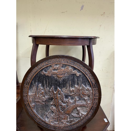 1304 - A walnut lamp table, another, and a carved Asian plaque (3)