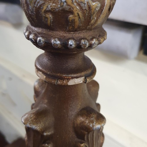 1161 - A carved gilt and gesso picket candlestick, 90 cm high