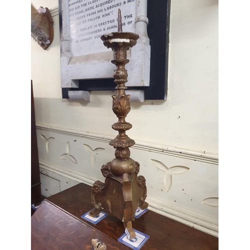 1161 - A carved gilt and gesso picket candlestick, 90 cm high