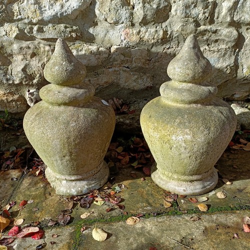 1309 - A pair of composite stone garden finials, 44 cm high