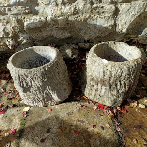 1308 - A pair of composite stone garden planters, in the form of logs, 26 cm high