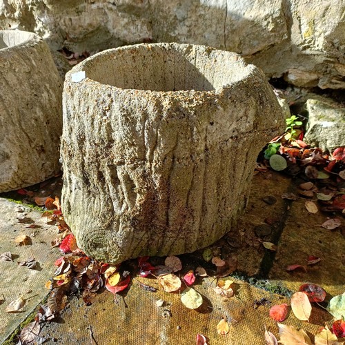 1308 - A pair of composite stone garden planters, in the form of logs, 26 cm high