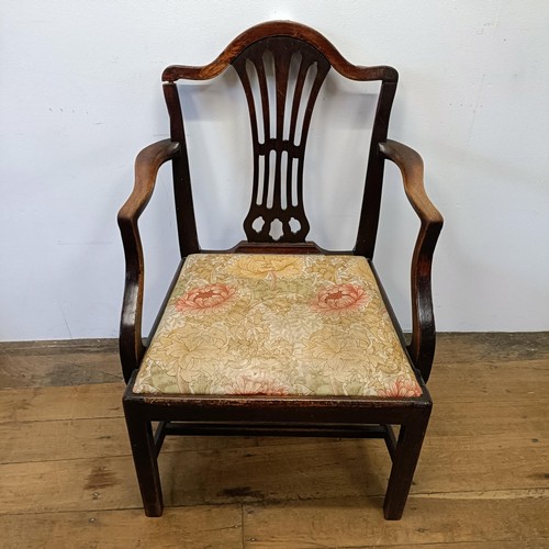 1206 - A 19th century mahogany armchair, with a pierced splat back and drop in seat