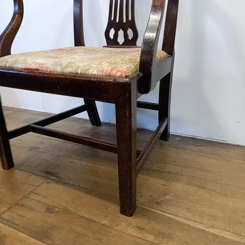 1206 - A 19th century mahogany armchair, with a pierced splat back and drop in seat