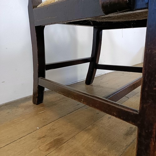 1206 - A 19th century mahogany armchair, with a pierced splat back and drop in seat