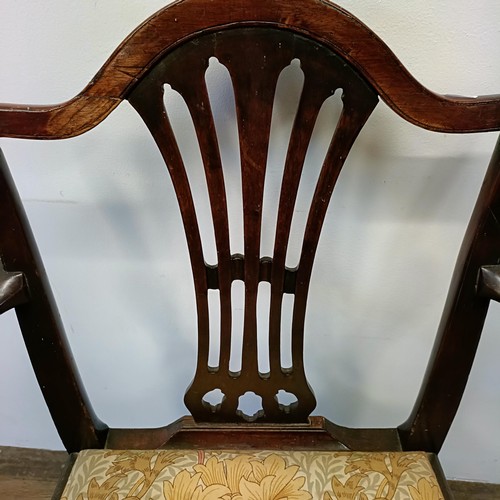 1206 - A 19th century mahogany armchair, with a pierced splat back and drop in seat