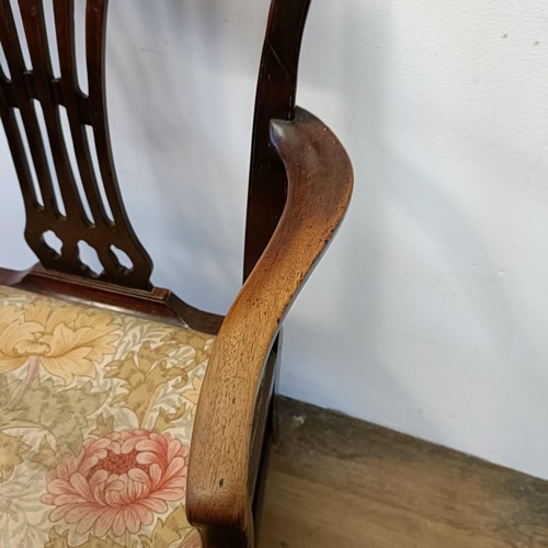 1206 - A 19th century mahogany armchair, with a pierced splat back and drop in seat