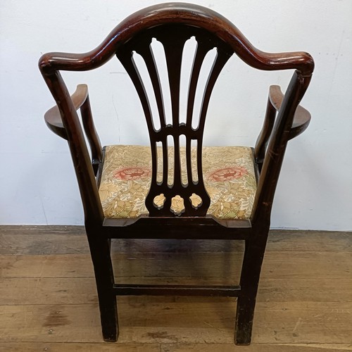 1206 - A 19th century mahogany armchair, with a pierced splat back and drop in seat