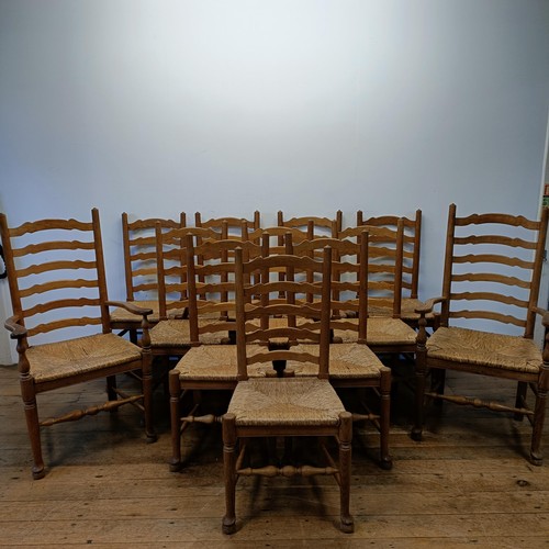 1204 - A set of twelve oak ladder back dining chairs, with reeded seats (10 +2)