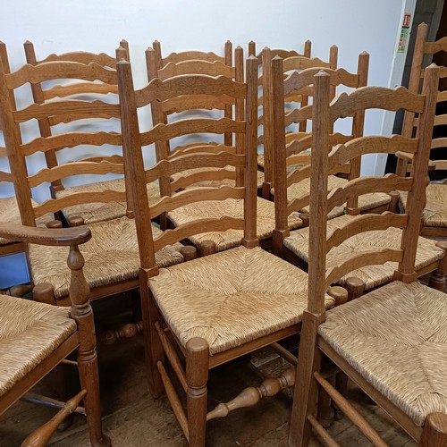 1204 - A set of twelve oak ladder back dining chairs, with reeded seats (10 +2)