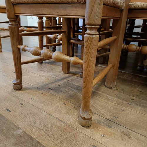 1204 - A set of twelve oak ladder back dining chairs, with reeded seats (10 +2)