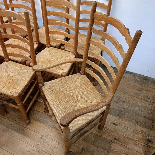 1204 - A set of twelve oak ladder back dining chairs, with reeded seats (10 +2)