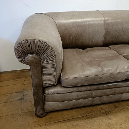 1211 - A grey leather sofa, 226 cm wide