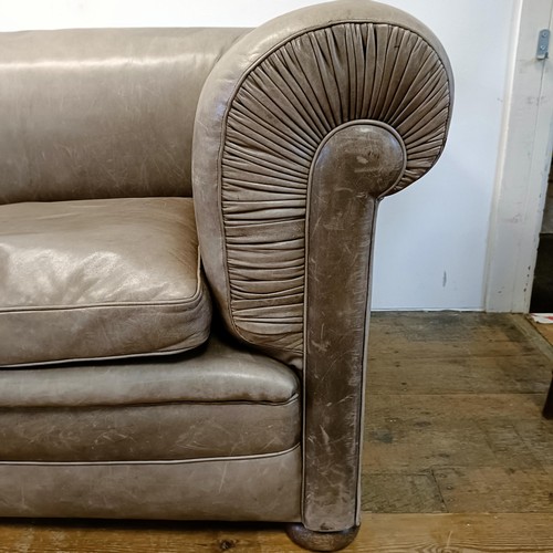 1211 - A grey leather sofa, 226 cm wide