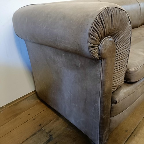 1211 - A grey leather sofa, 226 cm wide