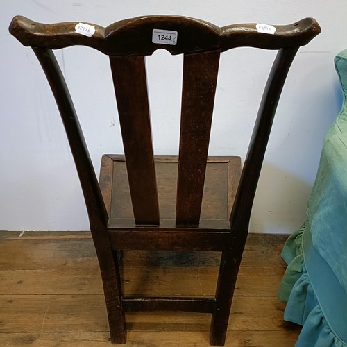 1244 - An early 20th century armchair, and an oak single chair (2)