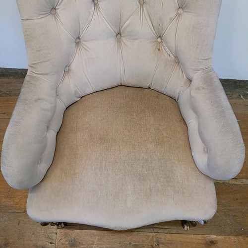 1208 - A 19th century button back armchair, on cabriole legs