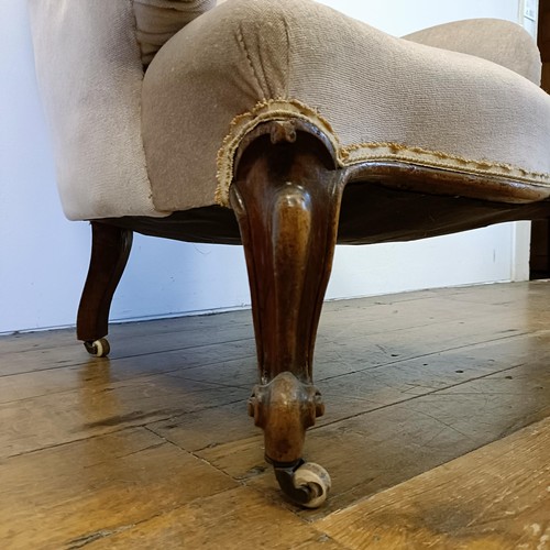 1208 - A 19th century button back armchair, on cabriole legs