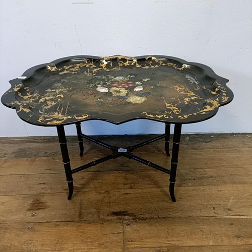 1318 - A late 19th/early 20th century papier mache tray top table, 83 cm wide