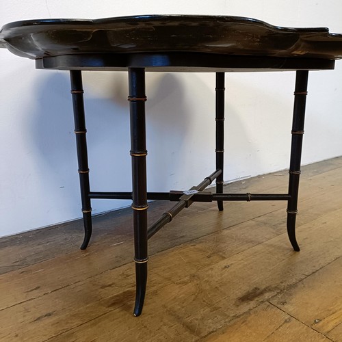 1318 - A late 19th/early 20th century papier mache tray top table, 83 cm wide