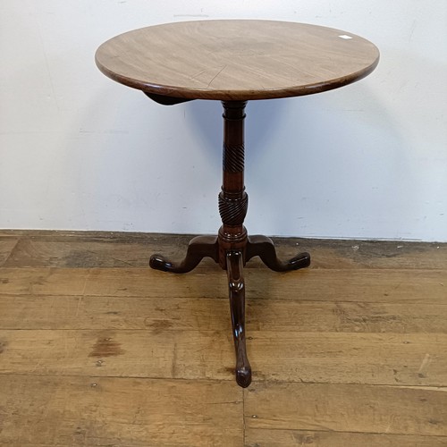 1317 - A 19th century mahogany table, on a tripod base, diameter 56 cm diameter