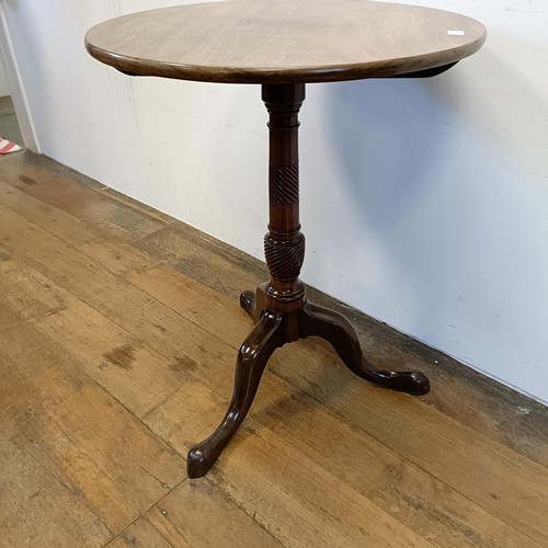 1317 - A 19th century mahogany table, on a tripod base, diameter 56 cm diameter