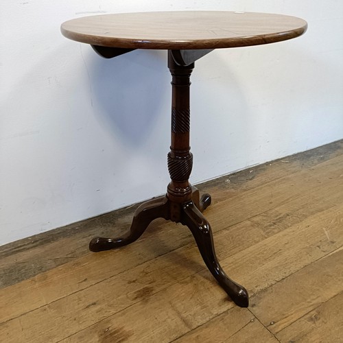 1317 - A 19th century mahogany table, on a tripod base, diameter 56 cm diameter