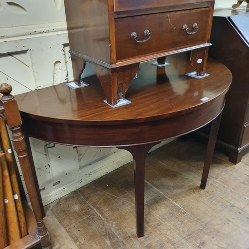 1188 - An early 20th century mahogany bureau, 60 cm wide, and a mahogany demi-lune table, 133 cm wide (2)