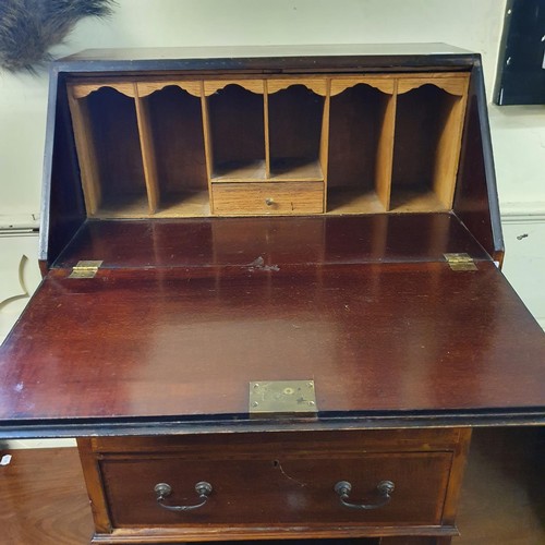 1188 - An early 20th century mahogany bureau, 60 cm wide, and a mahogany demi-lune table, 133 cm wide (2)