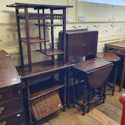 1190 - A oak student's bookcase, 61 cm wide, three tables, a wicker basket, and a walnut three tier table (... 