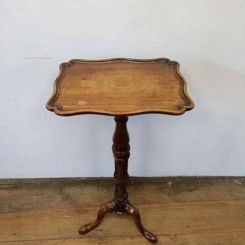 1313 - A 19th century rosewood table, on a carved column support with a tripod base, 74 cm high x 33 cm wid... 