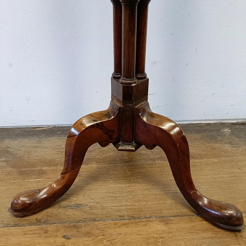 1313 - A 19th century rosewood table, on a carved column support with a tripod base, 74 cm high x 33 cm wid... 