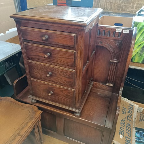 1295 - An oak settle, 87 cm wide, an oak bedside chest, a nest of tables, a washstand, a hall stand, and a ... 