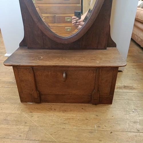 1278 - An oak cheval mirror, 165 cm high