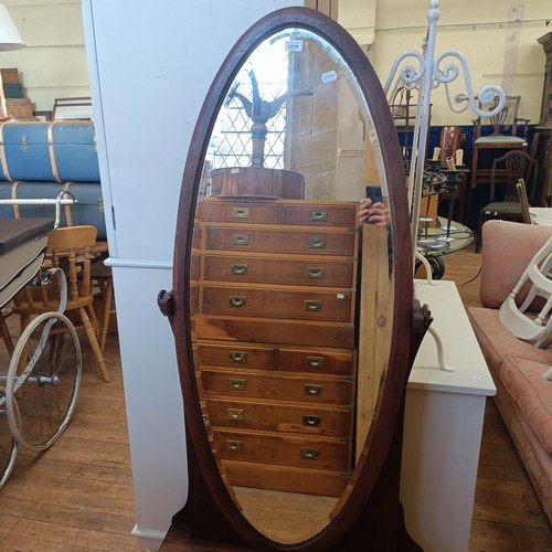 1278 - An oak cheval mirror, 165 cm high