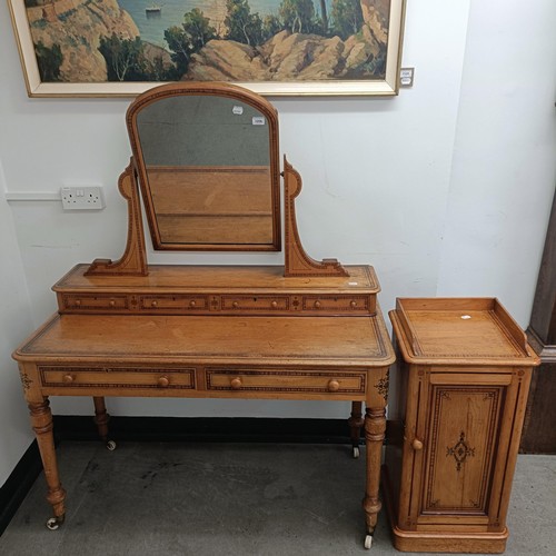 1259 - A Victorian pine dressing table, 125 cm wide and a matching bedside cupboard, 39 cm wide (2)