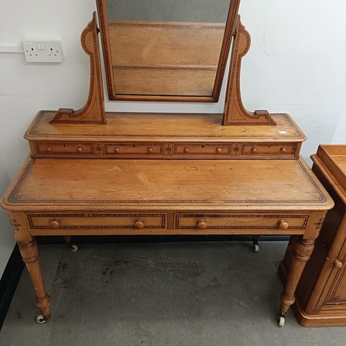 1259 - A Victorian pine dressing table, 125 cm wide and a matching bedside cupboard, 39 cm wide (2)