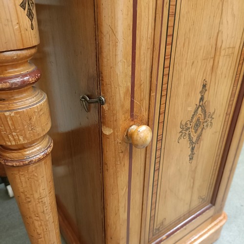 1259 - A Victorian pine dressing table, 125 cm wide and a matching bedside cupboard, 39 cm wide (2)