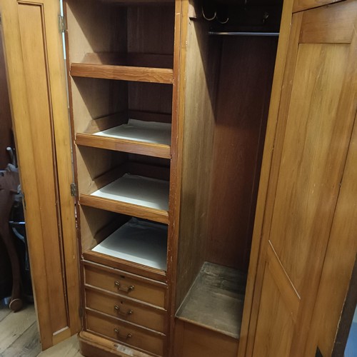 1257 - A Victorian pine wardrobe, with a mirrored door and painted decoration, 128 cm wide