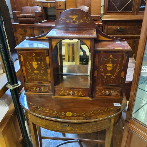 1224 - A early 20th century mahogany ladies' writing desk, the super structure having two cupboard doors, a... 