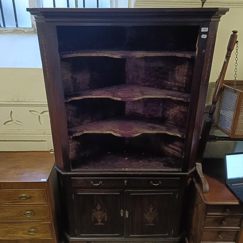 1253 - A mahogany free standing corner cabinet, 123 cm wide