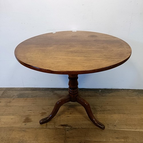 1245 - A 19th century mahogany tilt top table, on a column support tripod base, 80 cm wide, wall lights and... 