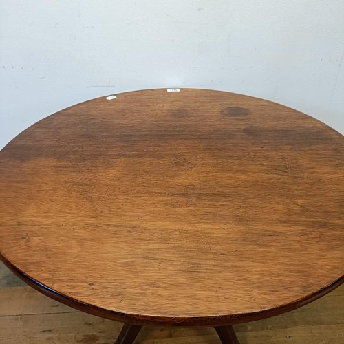 1245 - A 19th century mahogany tilt top table, on a column support tripod base, 80 cm wide, wall lights and... 